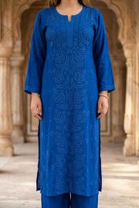 Blue rose-panel kurta in a heritage setting